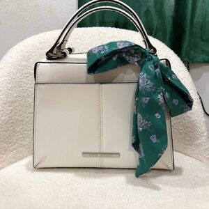 White Purse w Green tie as accessory. with adjustable strap and outside pocket
